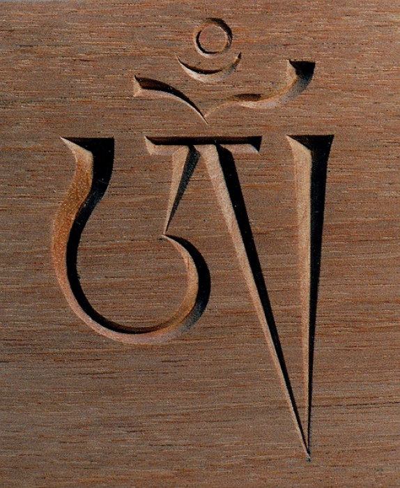 Om - Tibetan. Mahogany. H 8in